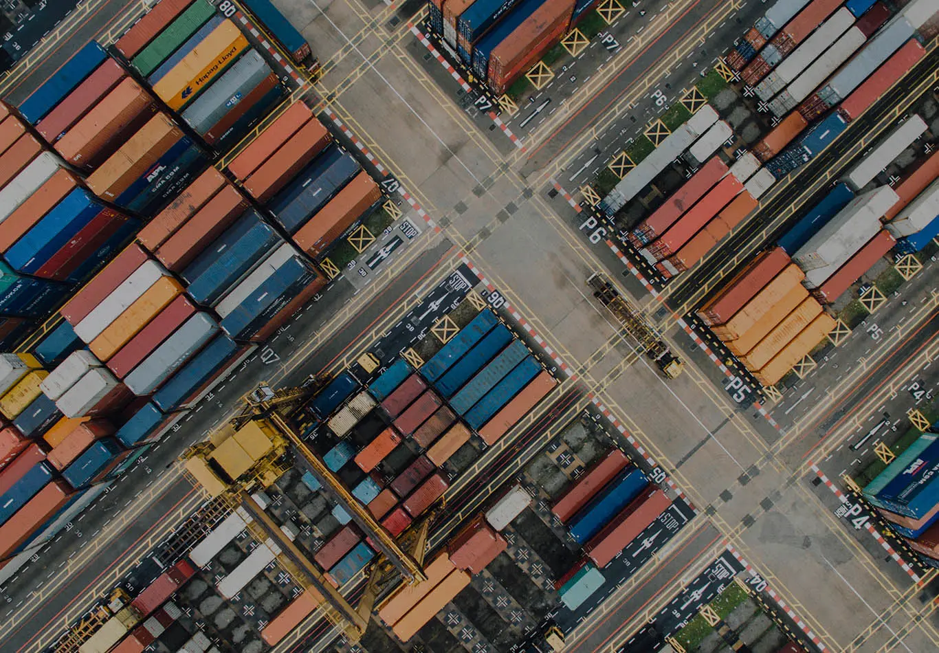 There are a cluster a shipping crates intersected by streets